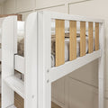Modern white loft bunk bed with natural wood vertical slats, built-in ladder and safety rail in a neutral bedroom setting