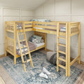 L-shaped wooden twin-over-twin bunk bed in kids' bedroom with ladders, neutral bedding, decorative pillows, patterned area rug and cozy floor chair