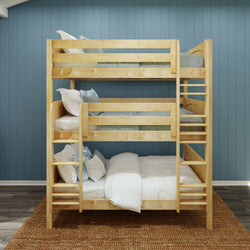 Wooden triple bunk bed with white bedding and blue pillows in a modern bedroom setting with a blue accent wall.