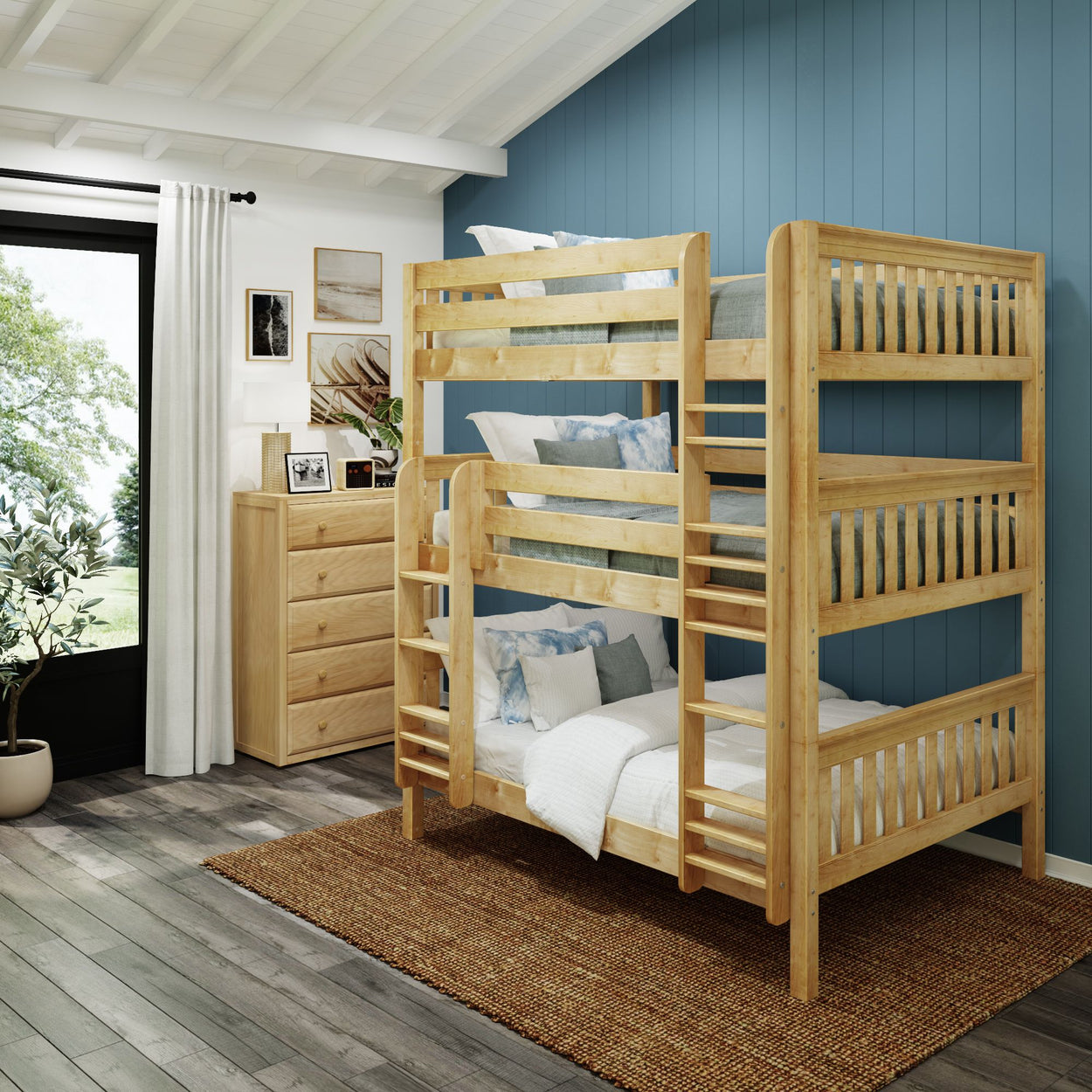 Wooden bunk bed in cozy bedroom with blue accent wall and natural light streaming in through the window.