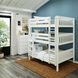 White triple bunk bed in a modern bedroom with blue accent wall and natural lighting.