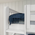 Close-up of a white wooden bunk bed rail with a navy blue tasseled throw blanket against a vertical shiplap wall in a modern bedroom