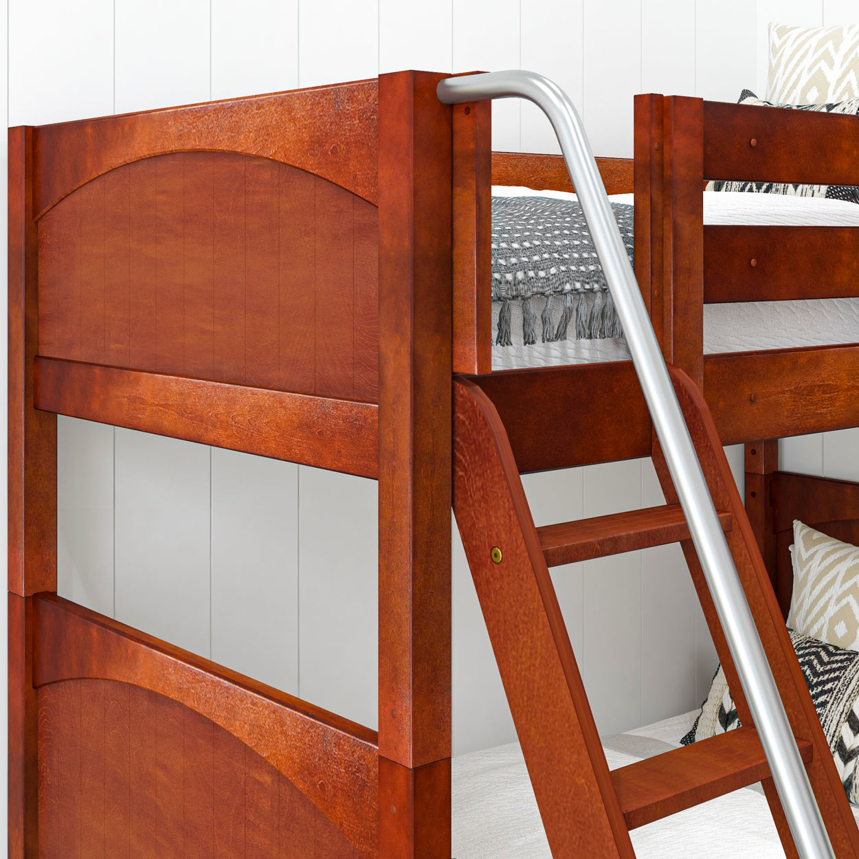Wooden bunk bed with ladder and stylish bedding in a modern bedroom setting.