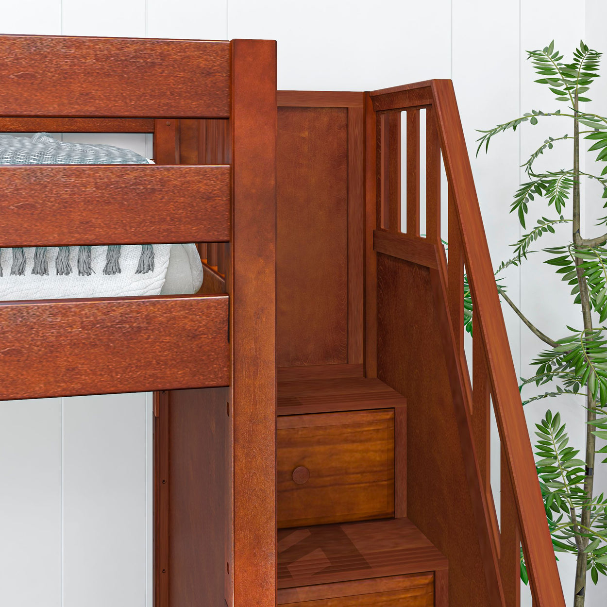 Wooden bunk bed with staircase storage and green plant in bedroom setting.