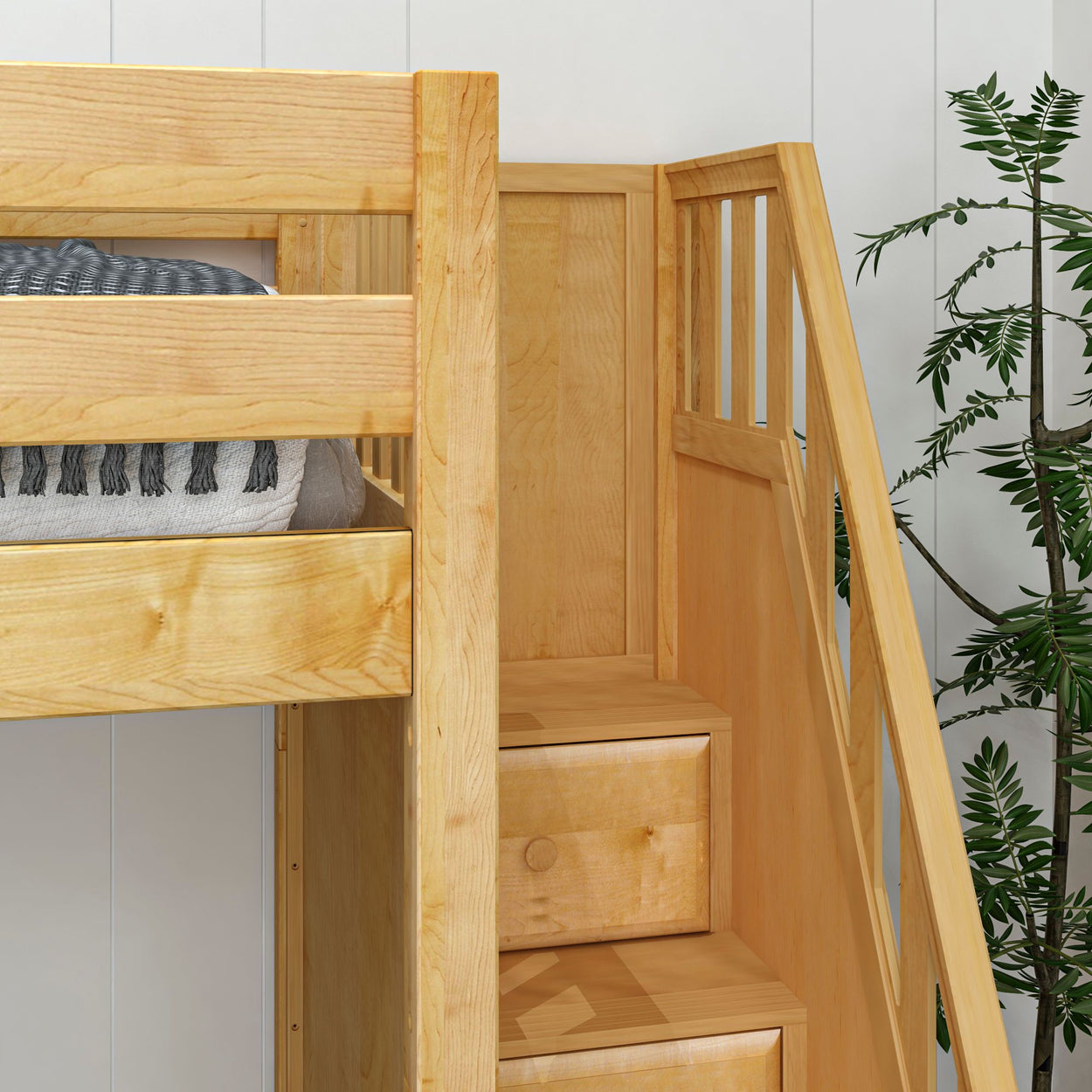 Natural wood bunk bed with built-in stairs and cozy bedding in a modern interior setting.
