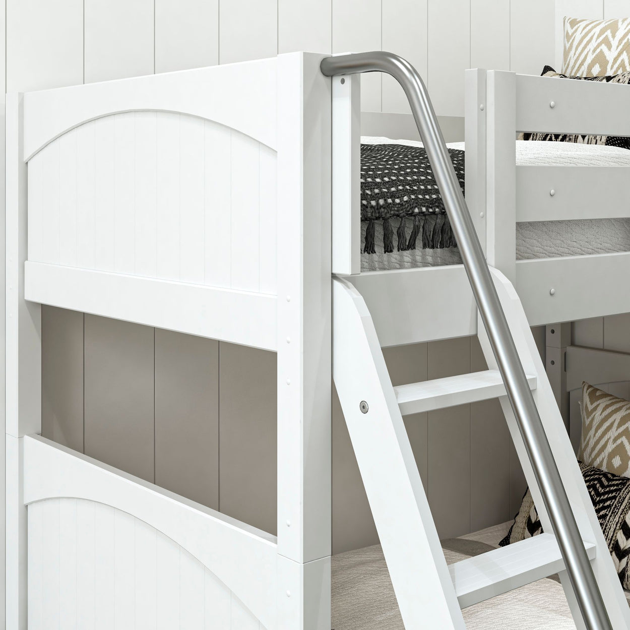 White wooden bunk bed with ladder and patterned bedding in modern bedroom setting.