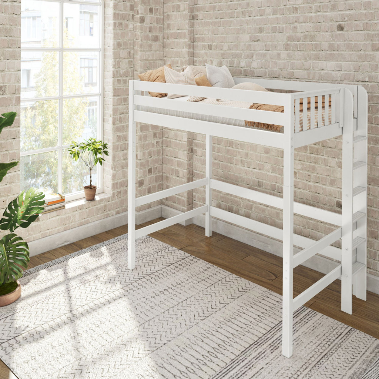 White wooden loft bed in a bright, modern bedroom with brick walls and indoor plants.