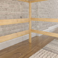 Whitewashed brick interior wall with light wood horizontal railing, hardwood floor and patterned rug in a modern rustic home interior