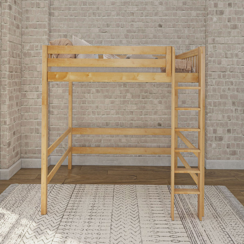 Natural wood loft bed with ladder, neutral pillows and throw against an exposed light brick wall over a patterned area rug