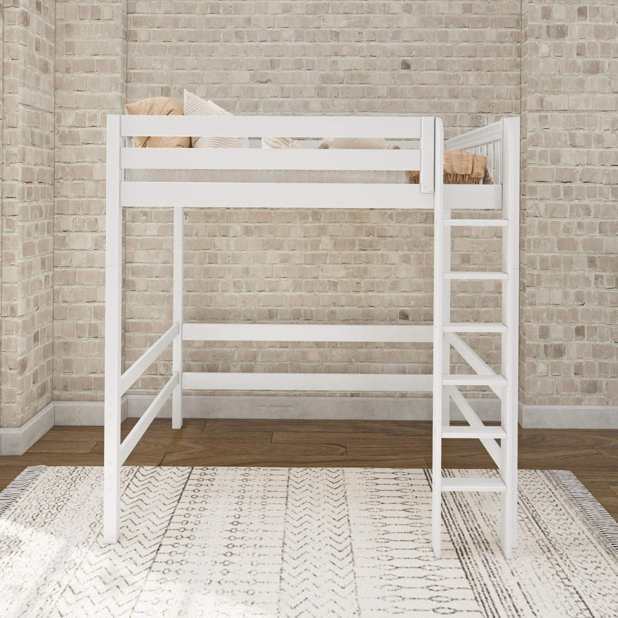 White wooden loft bed with built-in ladder against brick wall on decorative rug.