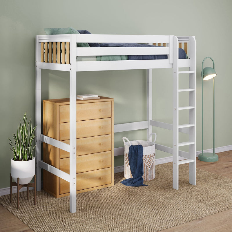 White wooden loft bed with ladder and under-dresser storage, blue-green bedding, wicker laundry basket, potted snake plant and mint floor lamp against pale green wall