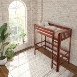 Loft bed in a modern bedroom with large window and brick walls.