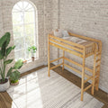 Wooden loft bed in a bright industrial bedroom with exposed white brick wall, arched window, neutral bedding and indoor plants
