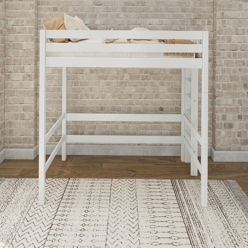 Modern white wooden loft bed with guardrails, beige striped pillows and throw against an exposed brick wall and patterned rug