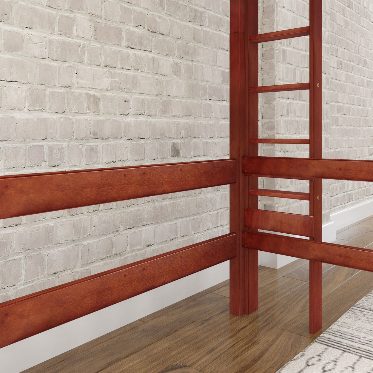 Wooden loft bed frame with ladder against a white brick wall.