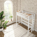 White loft bed in bright boho nursery with exposed whitewashed brick wall, arched window streaming natural light, neutral bedding and indoor plants