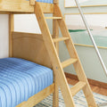 Close-up of a wooden bunk bed ladder and light blue quilted bedding in a modern kids' bedroom with framed wall art and hardwood floor