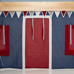 Children's indoor fabric playhouse facade with navy blue walls, red curtain door and window flaps, and white triangular pennant bunting