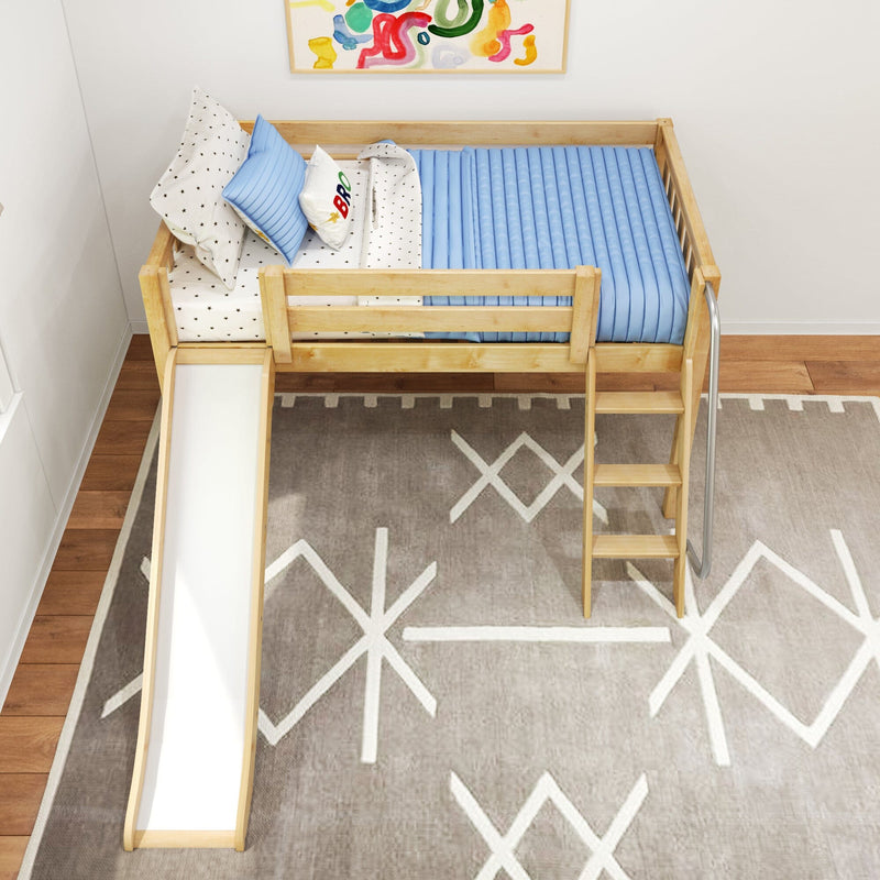 Top-down view of a wooden kids loft bed with slide and ladder, blue ribbed mattress, star-patterned bedding, colorful wall art and geometric rug in a modern children's bedroom