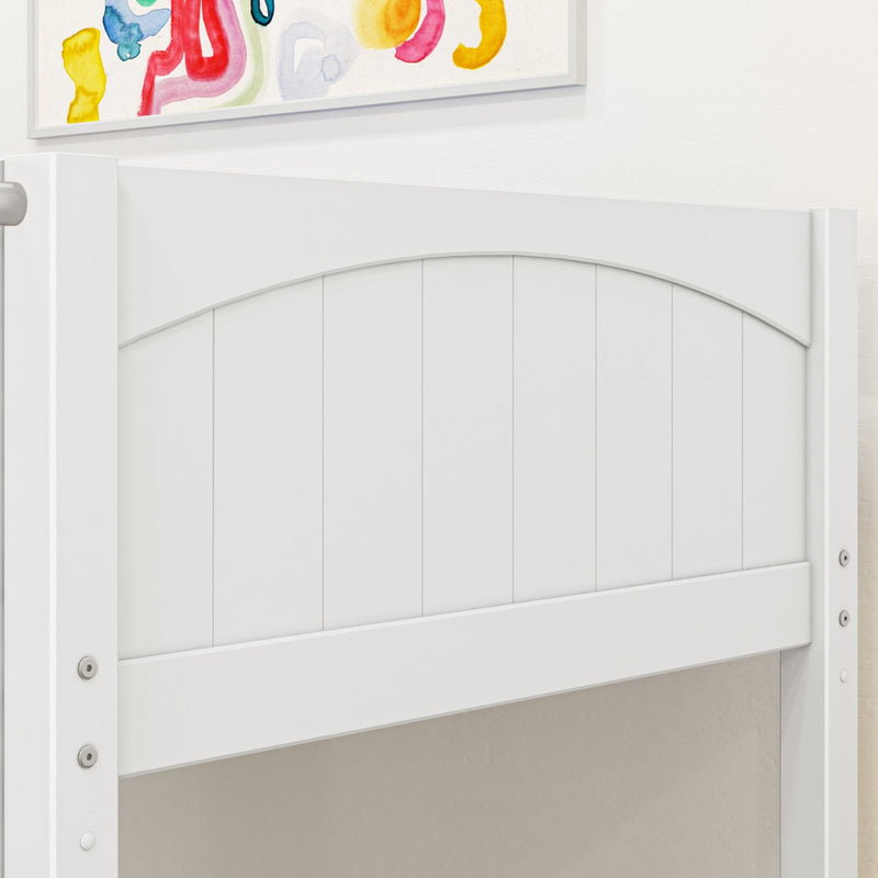 Close-up of white wooden panel headboard with arched top and visible hardware beneath colorful abstract wall art, modern nursery or kids bedroom decor