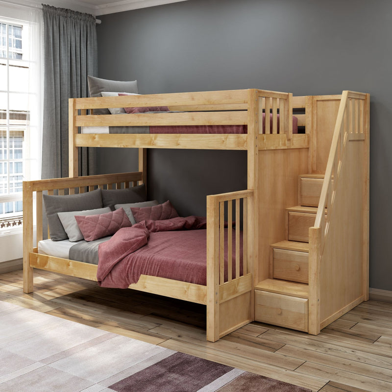 Natural wood bunk bed with built-in stairs and storage drawers, pink and gray bedding in a modern kids' bedroom with gray accent wall and window