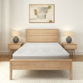 Modern minimalist bedroom with wooden bedframe, memory foam mattress, and abstract wall art.