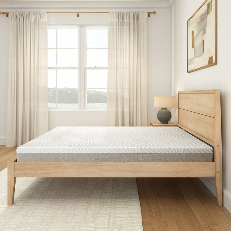 Modern minimalist bedroom with a natural wood bed frame, comfortable mattress, and soft natural light ambiance.