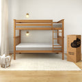 Wooden bunk bed with mattresses, cozy bedroom setup, and packaging box for twin cooling comfort mattress.