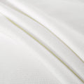 White waffle knit fabric texture for clothing and upholstery design.