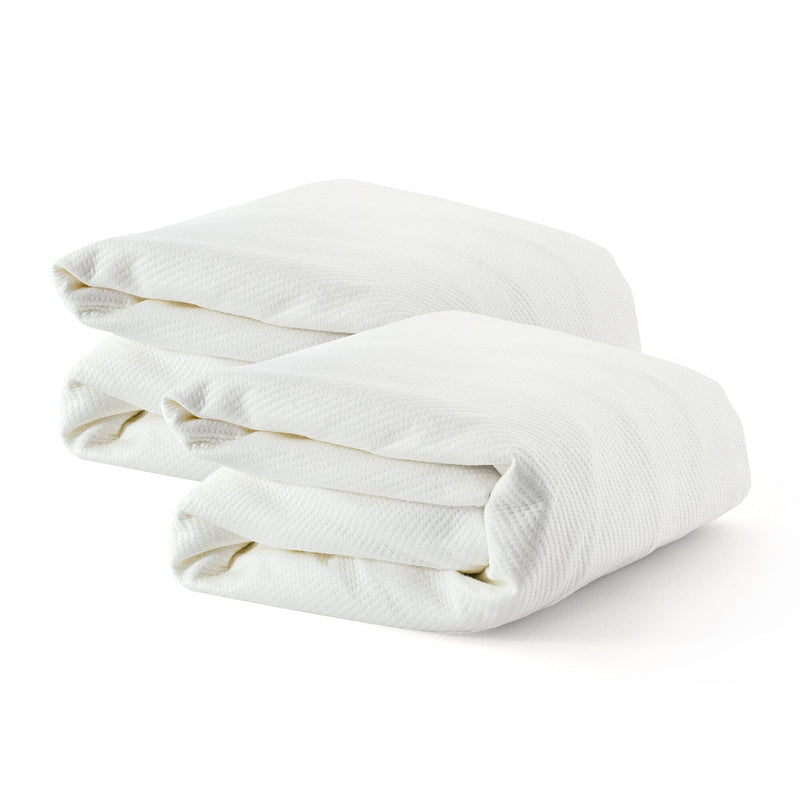 Two folded white hotel-quality cotton bed sheets isolated on a white background.
