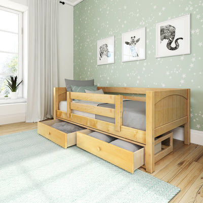 Modern children's room with a wooden daybed, pull-out drawers, and animal-themed wall art.