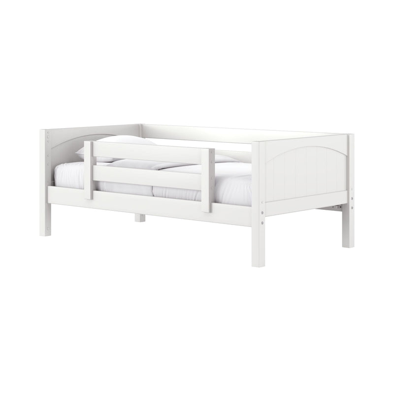 White wooden toddler bed with safety guardrail, paneled headboard and white bedding