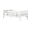 White wooden toddler bed with safety guardrails and white mattress, modern nursery daybed frame for kids' bedroom furniture