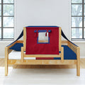 Natural wood toddler bed with red and navy blue playhouse tent canopy and clear window, blue bedding and white mattress in a bright modern kids bedroom