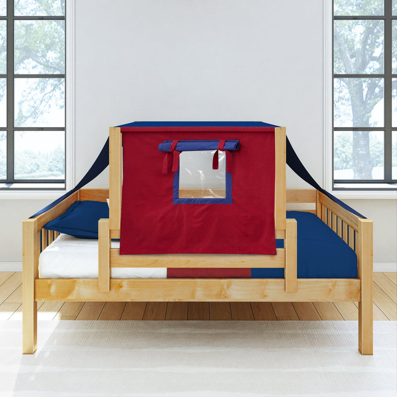 Natural wood toddler bed with red and navy blue playhouse tent canopy and clear window, blue bedding and white mattress in a bright modern kids bedroom