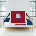 White wooden children's bed with red play-tent canopy and navy blue bedding in bright modern bedroom