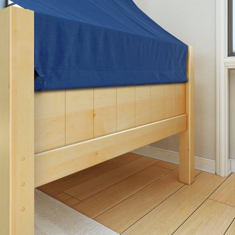 Close-up of light pine platform bed frame with blue fitted sheet on hardwood floor in a minimalist bedroom corner