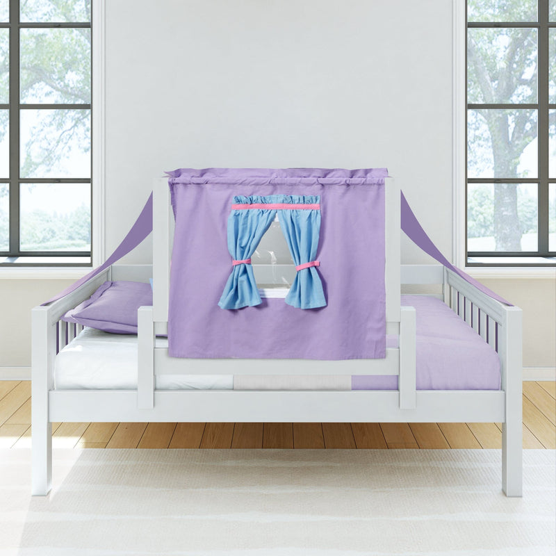 Toddler bed with purple playhouse canopy and blue tie-back curtains on a white wooden frame with lavender bedding in a bright kids' bedroom